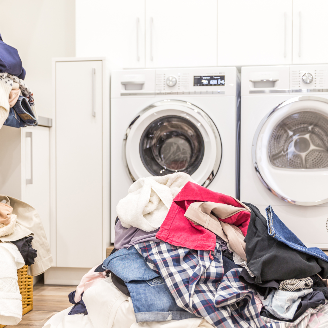 Organised laundry room with sorted baskets — laundry room organisation ideas for busy families