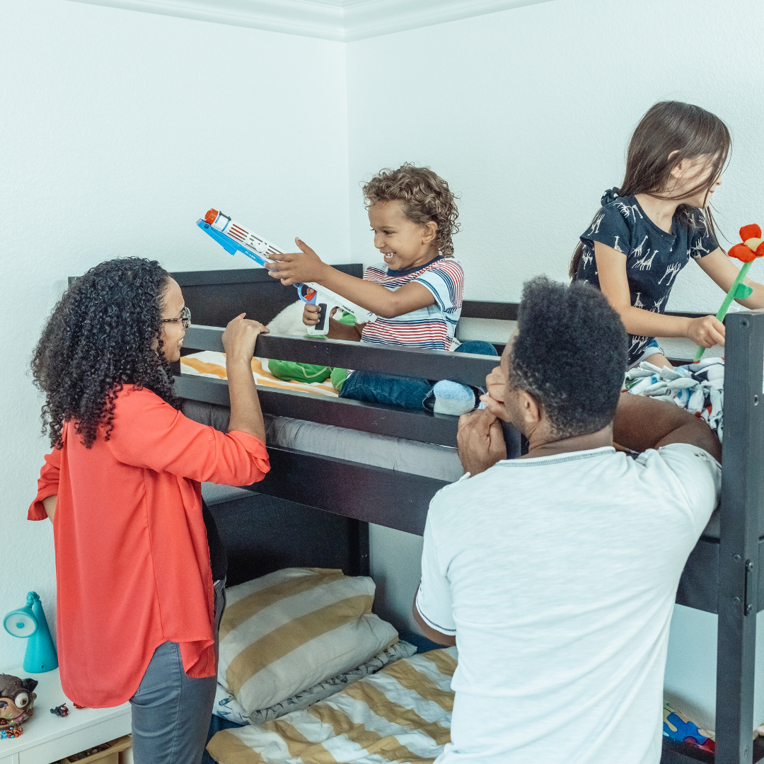 family decluttering session with keep donate and bin boxes in the living room