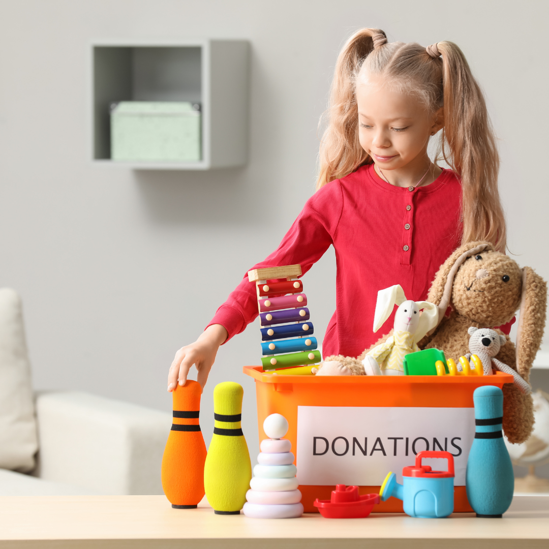 Daughter toys into keep and donate piles