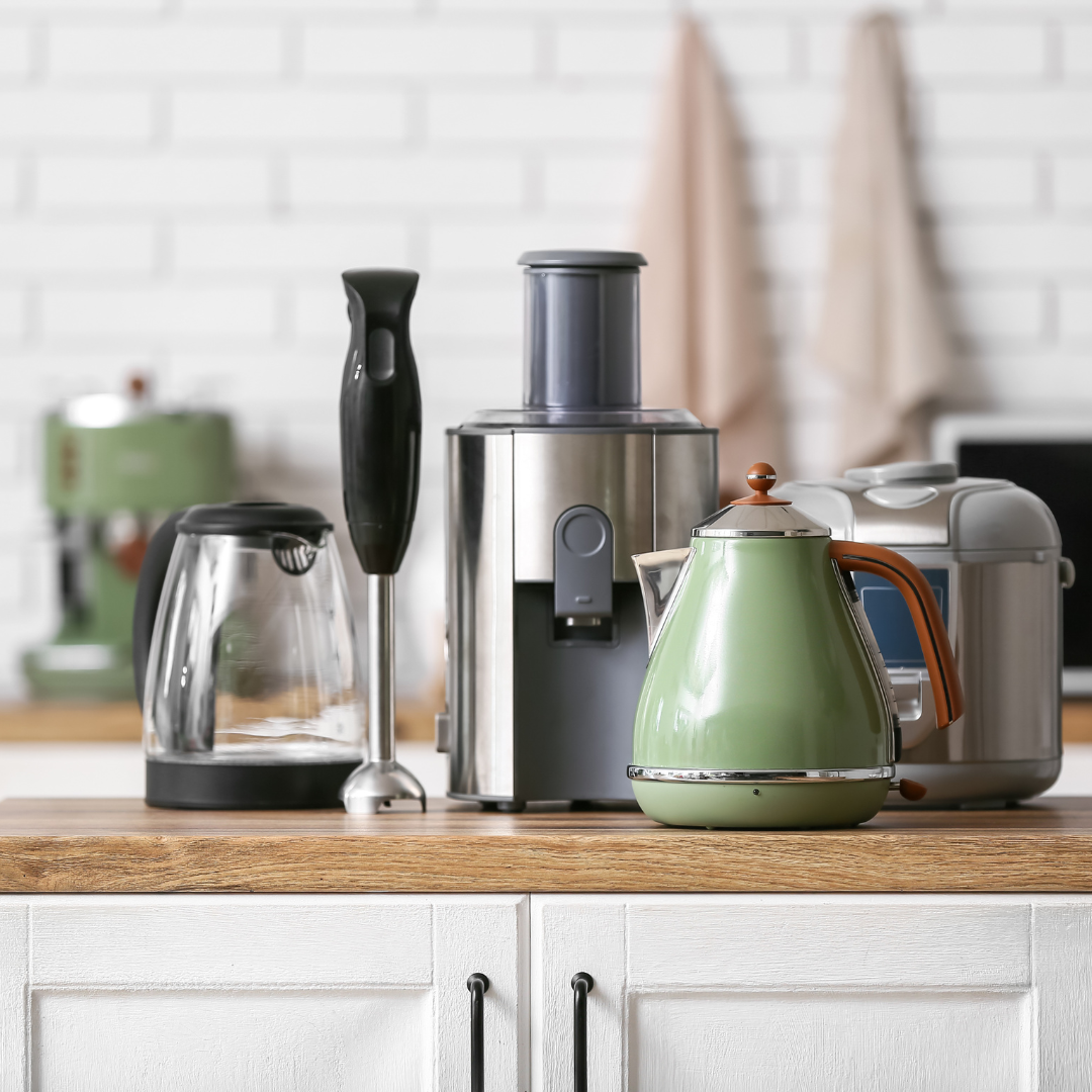Decluttering kitchen appliances into labelled storage baskets