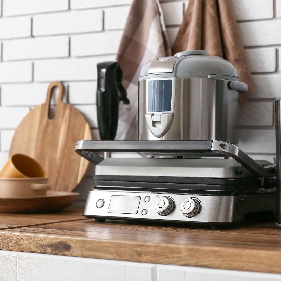 Kitchen appliances stored neatly in a cupboard