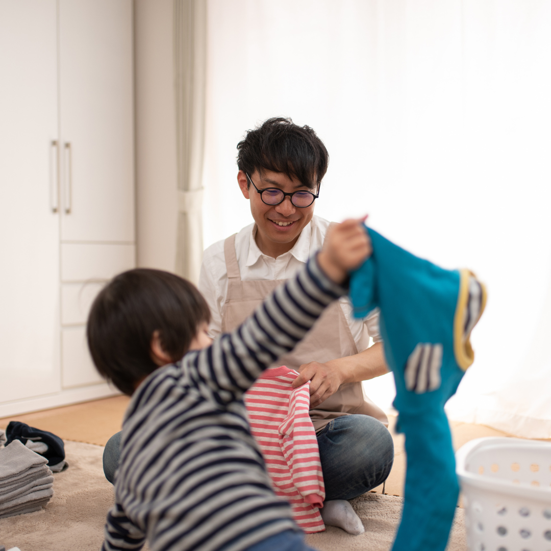 Parent and child folding laundry together without redoing the work
