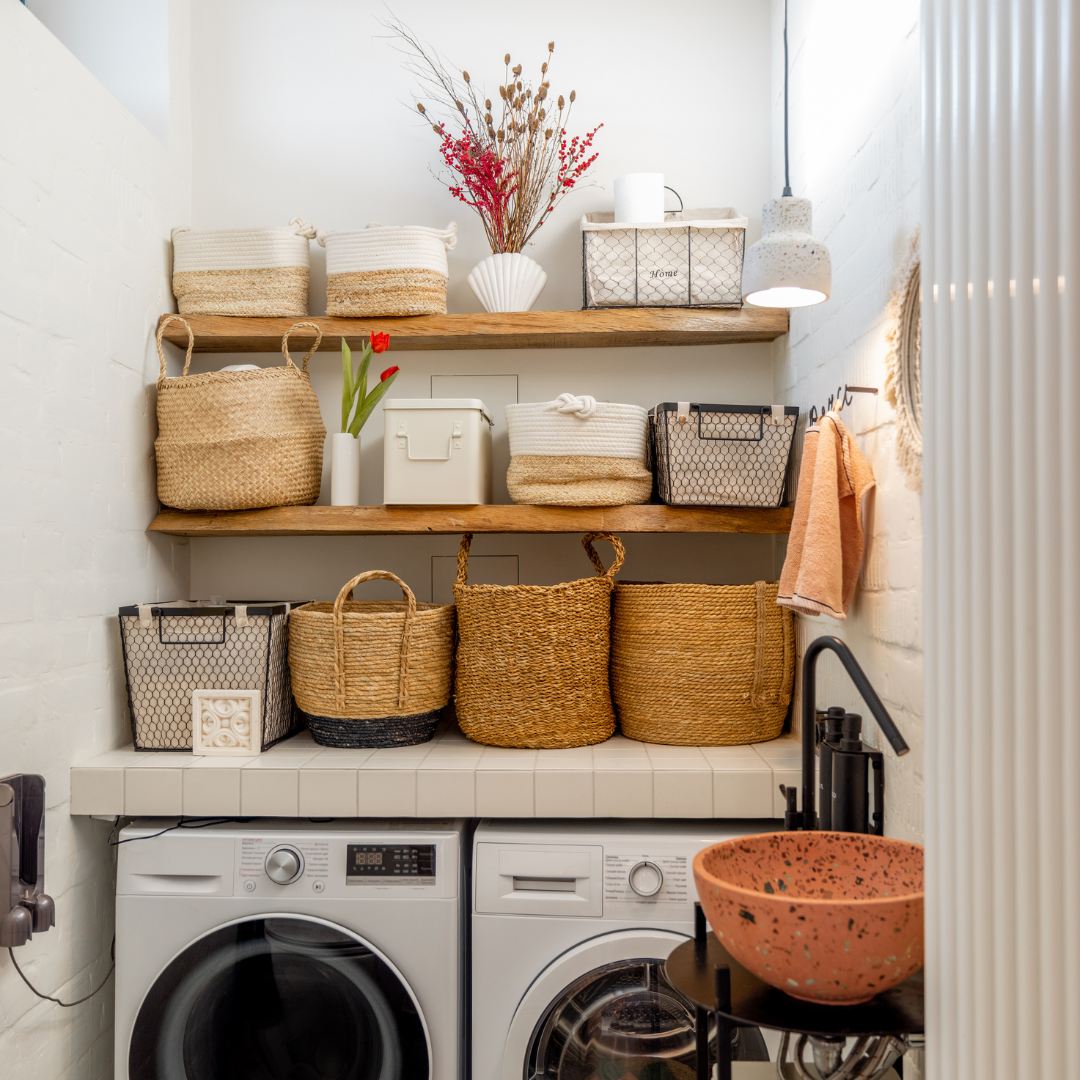 Labelled baskets organising laundry supplies by task