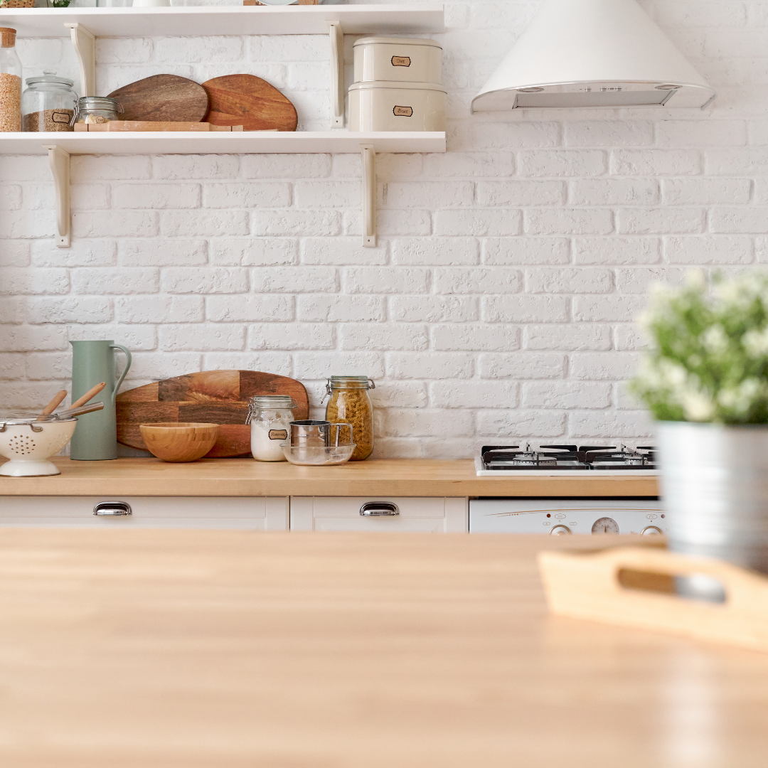 Clutter hotspots on a kitchen bench covered with mail, lunchboxes and chargers