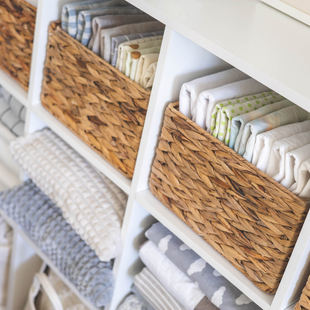 Organised linen cupboard with sheets and towels