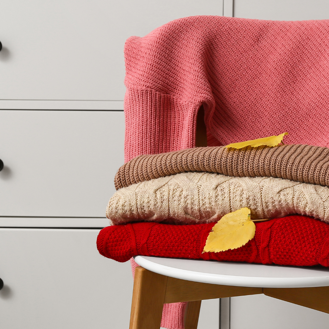 A bedroom chair draped with clothes that never made it back to the wardrobe